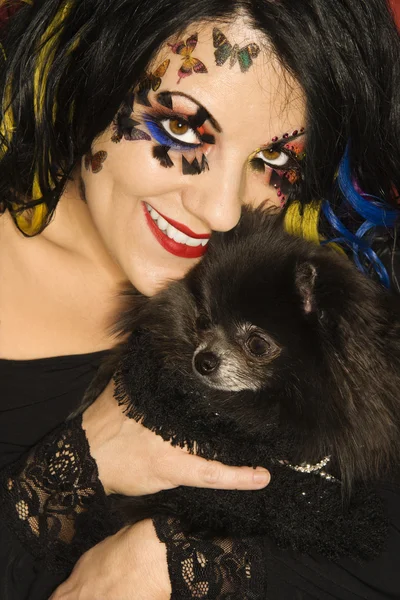 Woman holding Pomeranian dog. — Stock Photo, Image