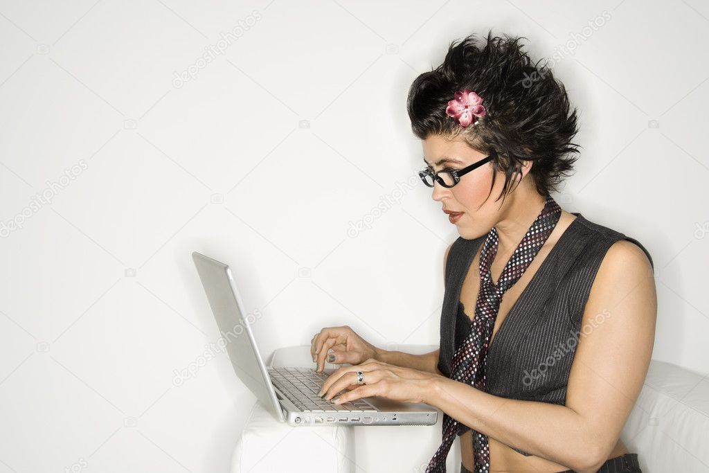 Latina woman on laptop.