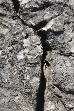 Lava rock with crack in Maui. clipart