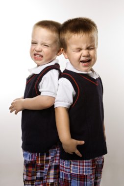 Twin boy brothers crying. clipart