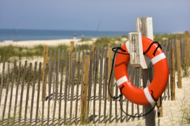 Life preserver on beach. clipart