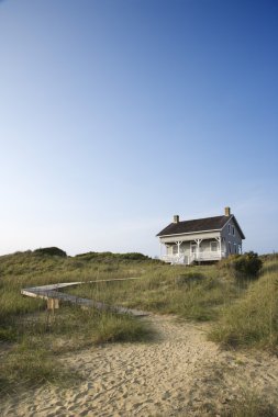 House with path to beach. clipart