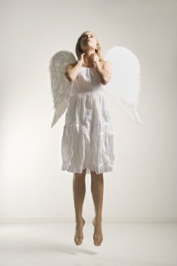Woman in angel costume. clipart