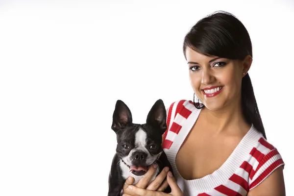 stock image Woman holding Boston Terrier dog.