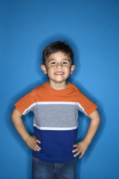 Boy standing with hands on hips. — Stock Photo, Image