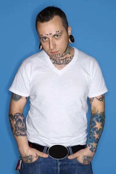 Man with tattoos and piercings. — Stock Photo, Image