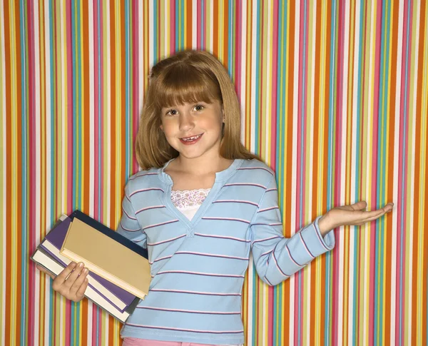 Girl holding books. — Stockfoto