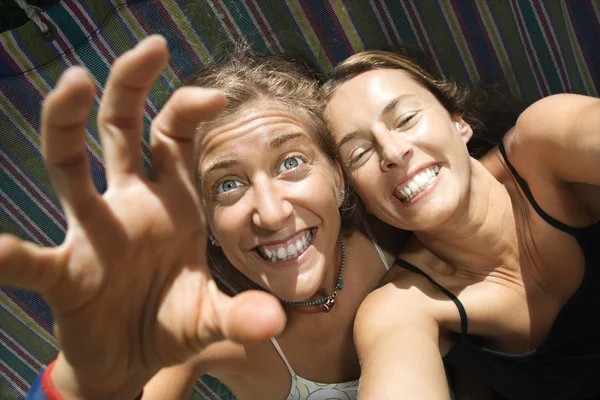 Women being silly in hammock. — Stock Photo, Image
