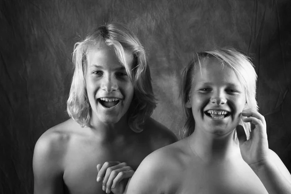 Two young brothers laughing. — Stock Photo, Image