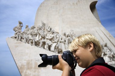 Boy photographing. clipart