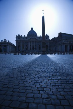 Obelisk in St Peters Square Backlit by the Sun clipart