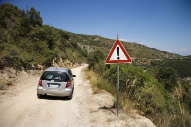 Car on dangerous road. clipart