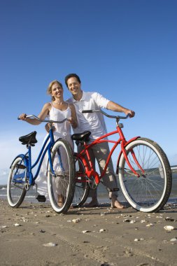 Couple with Bikes at the Beach clipart