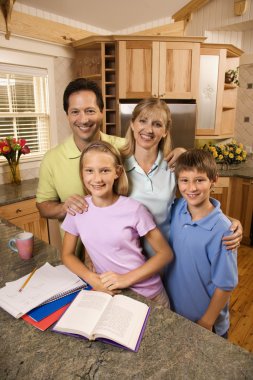 Family portrait in kitchen. clipart