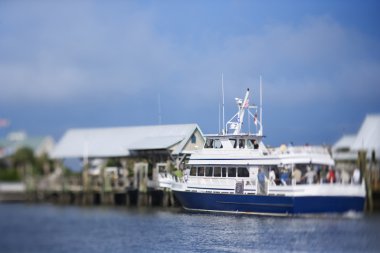 Ferry boat at dock. clipart