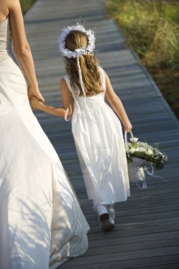 Bride and Flower Girl on Boardwalk clipart