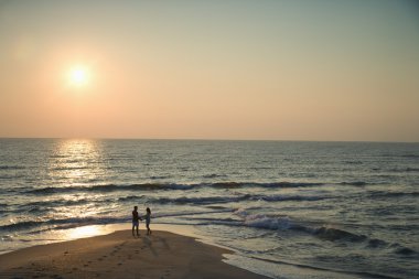 Couple on beach. clipart