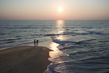 Couple on beach. clipart