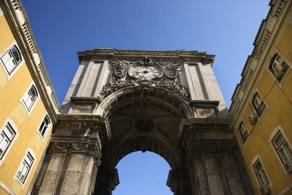 Building Arch with Clock in Lisbon — Stok fotoğraf