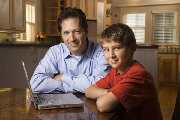 Man and Young Boy with Laptop — Stock Photo, Image