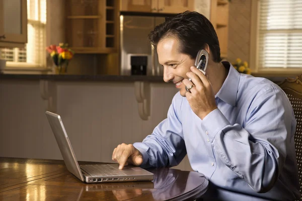 Man on Cell Phone and Laptop — Stock Photo, Image