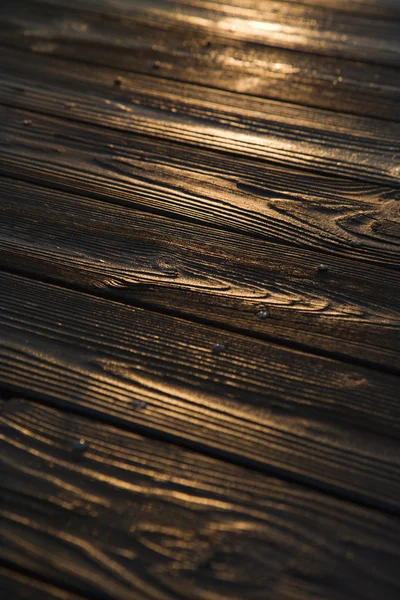 Pôr do sol refletido na madeira . — Fotografia de Stock