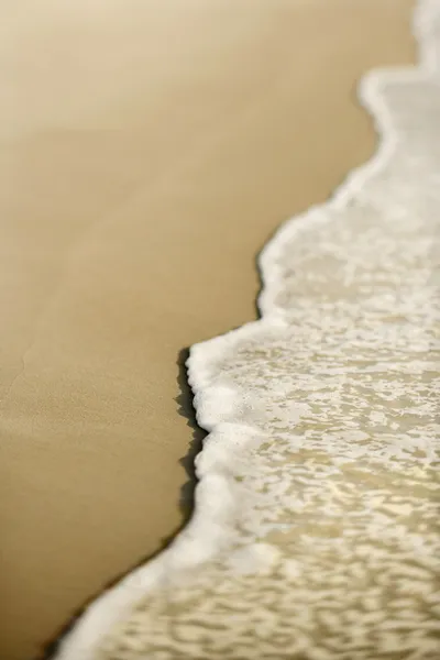 Met golven zand. — Stockfoto