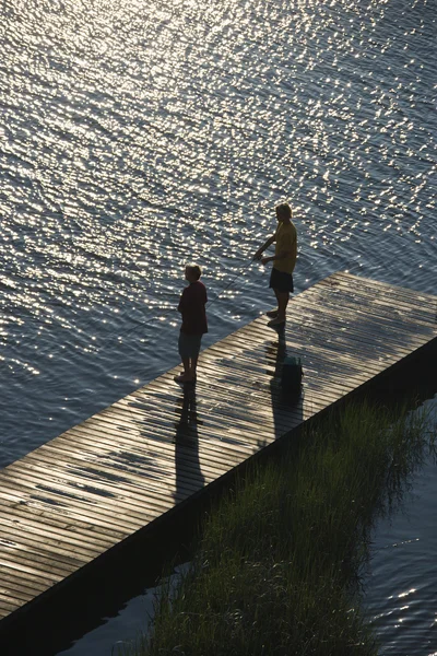 Boys fishing on dock. — Stock Photo, Image