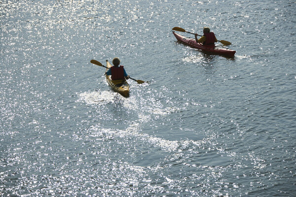 Boys in kayaks.