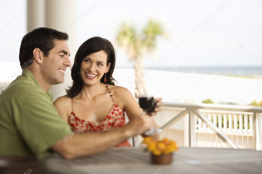 Couple Drinking and Smiling