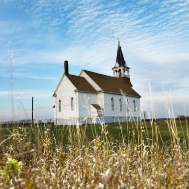 Rural church in field. clipart