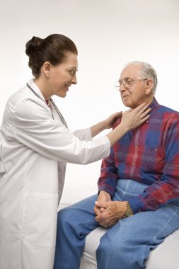 Doctor checking man's pulse. clipart