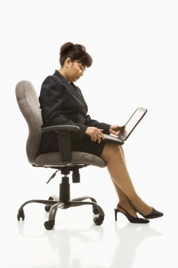 Businesswoman with laptop. clipart