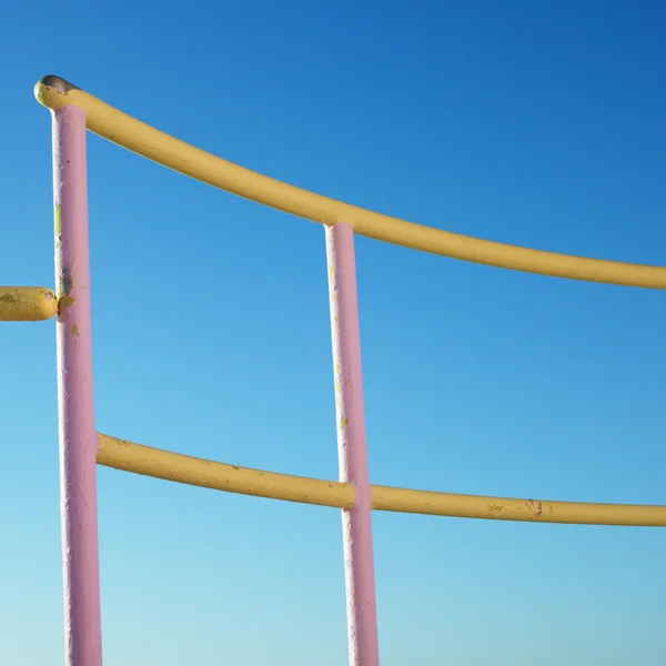 Pink and yellow railings. — Stock Photo, Image