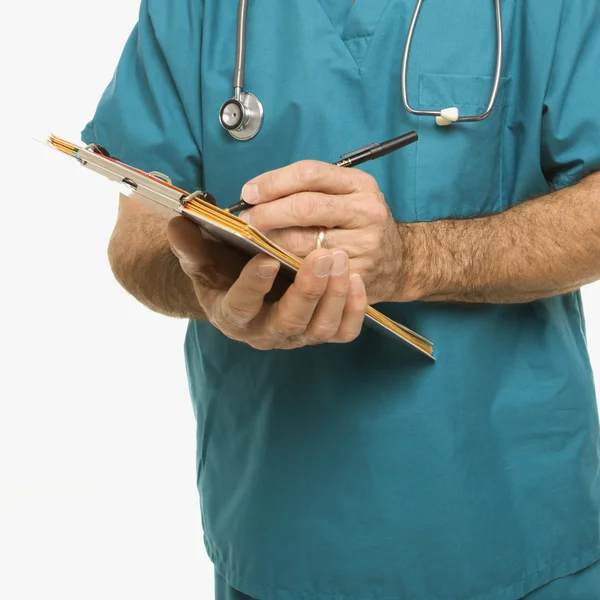 Läkare skriva anteckningar. — Stockfoto