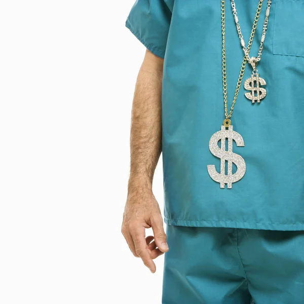 Doctor wearing dollar sign. — Stock Photo, Image