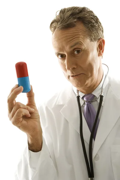Doctor with large pill. — Stock Photo, Image