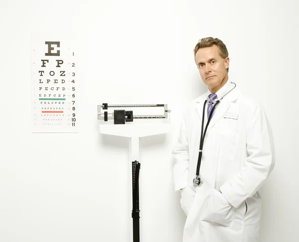 Doctor with scale. — Stock Photo, Image