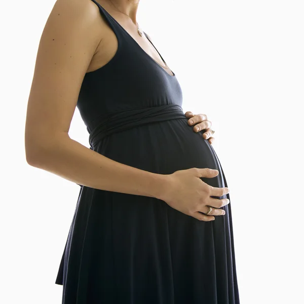 Holding a terhes nő hasa. — Stock Fotó