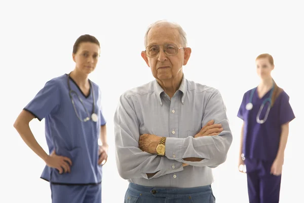 Man with medical workers. — Stock Photo, Image