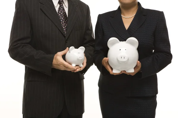 Ondernemers houden piggybanks. — Stockfoto