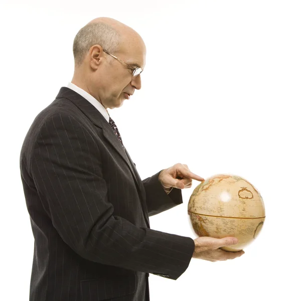 Empresario sosteniendo globo . — Foto de Stock