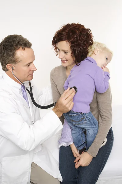 Mother and child with doctor. Stock Picture