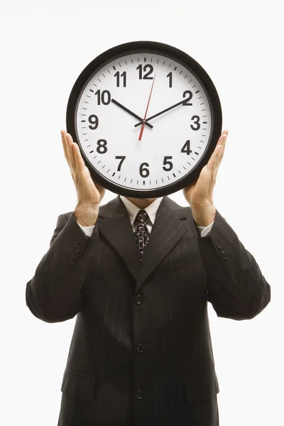 Businessman holding clock. — Stock Photo, Image