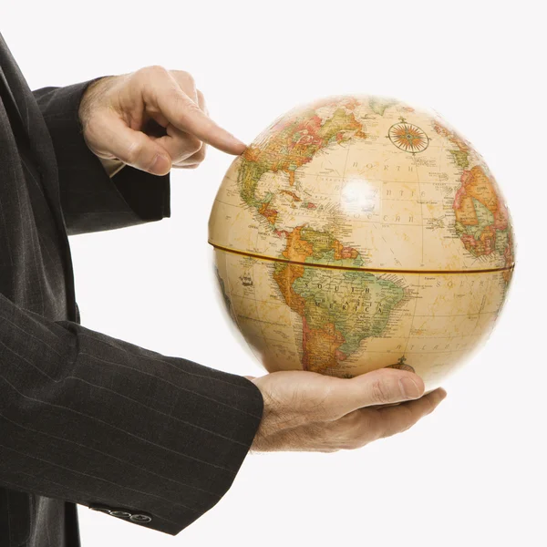 Businessman holding globe. — Stock Photo, Image