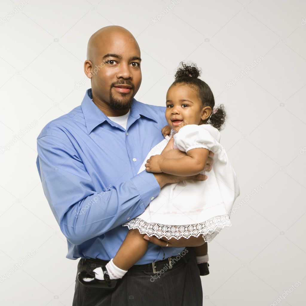 Man holding infant girl.