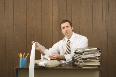 Man balancing books. clipart