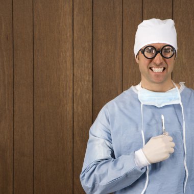 Crazy surgeon. clipart