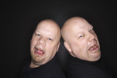 Bald twin men crying. clipart