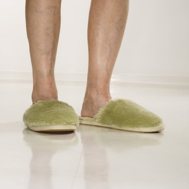 Feet wearing slippers. clipart